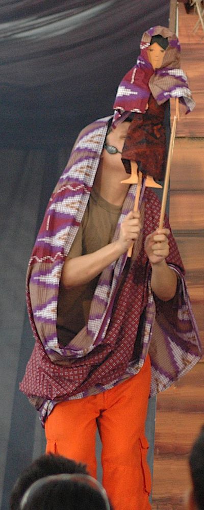 Actors in costume performing live theatre on stage